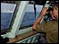 Israeli naval officer watches passenger ferry off Beirut - 18 July