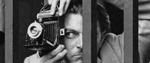 A man taking photographs through railings © Estate of Bob Collins/Museum of London
