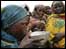 African children and feeding station