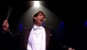 Alex James conducting in Episode 2