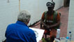 Rolf painting miner Carwyn Donavan, who works at Aberpergwm Colliery