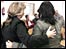 Two victims clasp each other as the verdicts are read out
