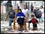 Family wades through flooded streets of Villahermosa in Tabasco