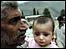 Father and daughter in quake-shattered Pakistani city of Muzaffarabad