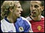 Manchester United's Rio Ferdinand (r) confronts Robbie Savage