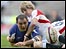 England's David Strettle gets to grips with France captain Raphael Ibanez