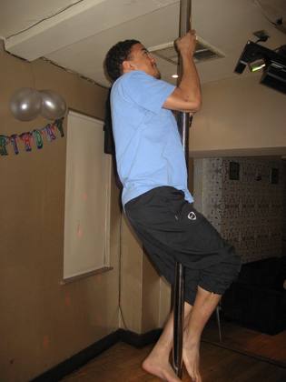 Dev climbs the pole