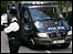 A police van carrying one of the accused arrives at court